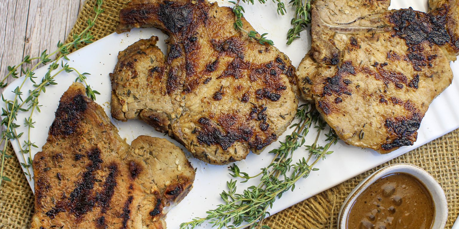 Grilled pork chop with salad and wild rice